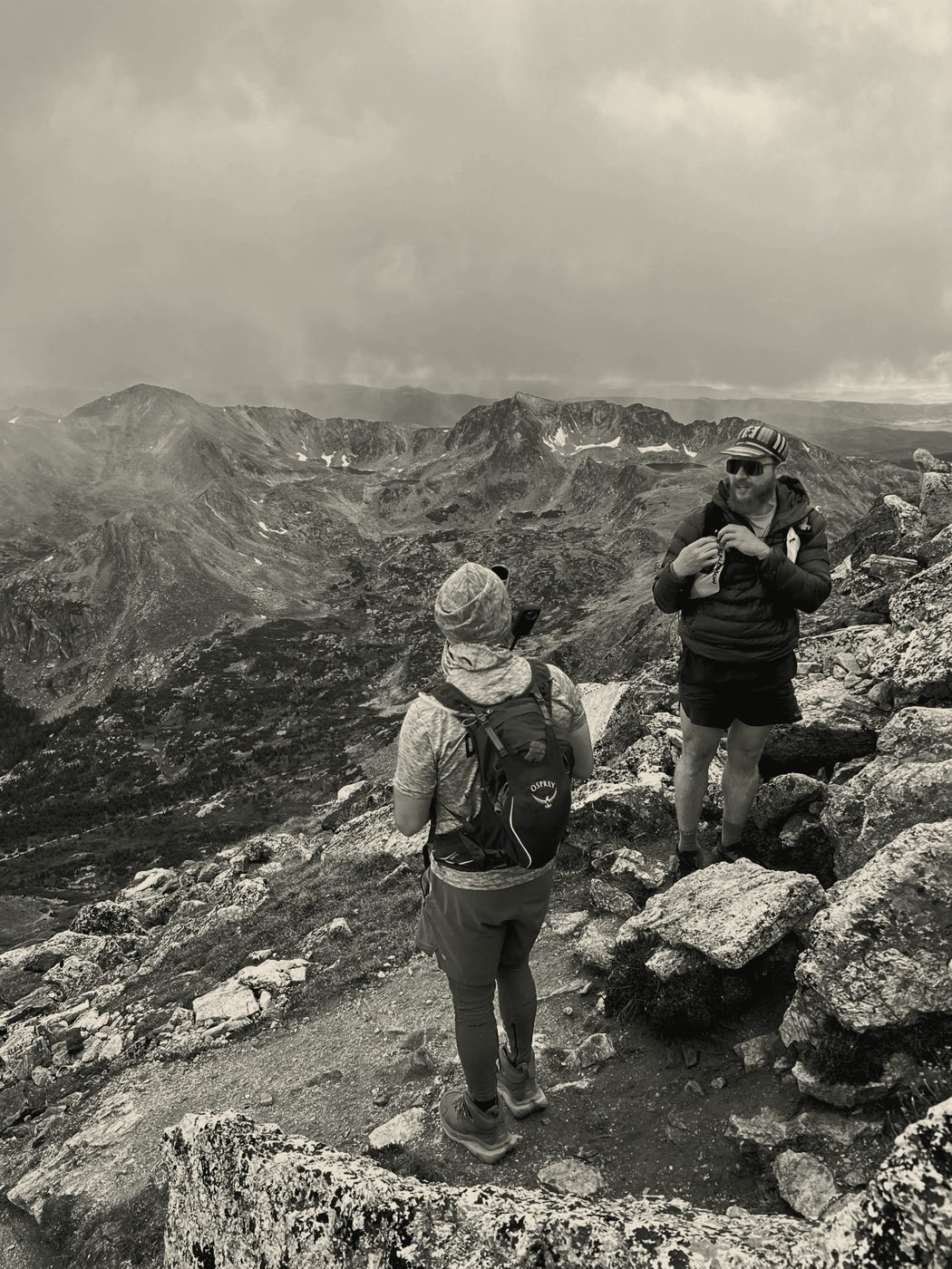 Hikers on an alpine trail above treeline